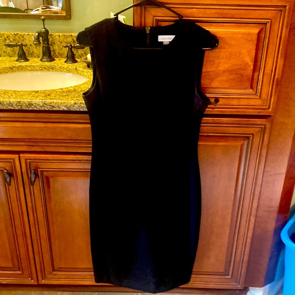Literally the perfect little black dress…flattering…covering…pencil silhouette